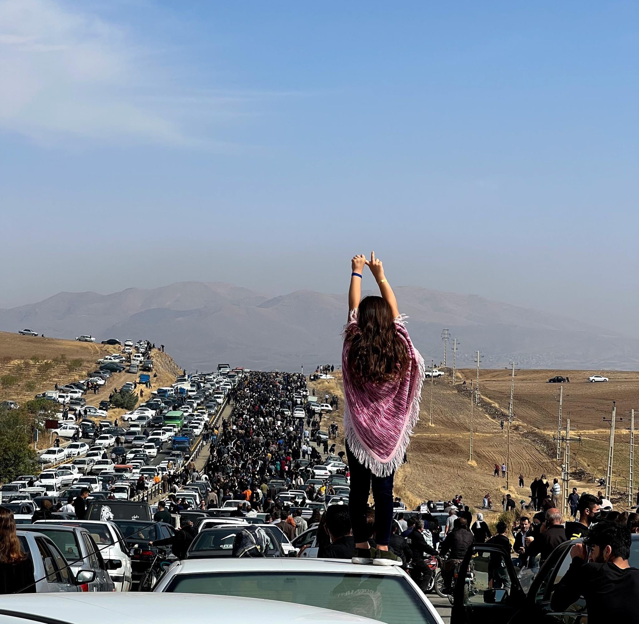 People Marching Towards Mahsa Amini's Grave